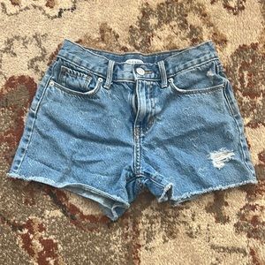 Girls size 8 Jean shorts with cute heart details.